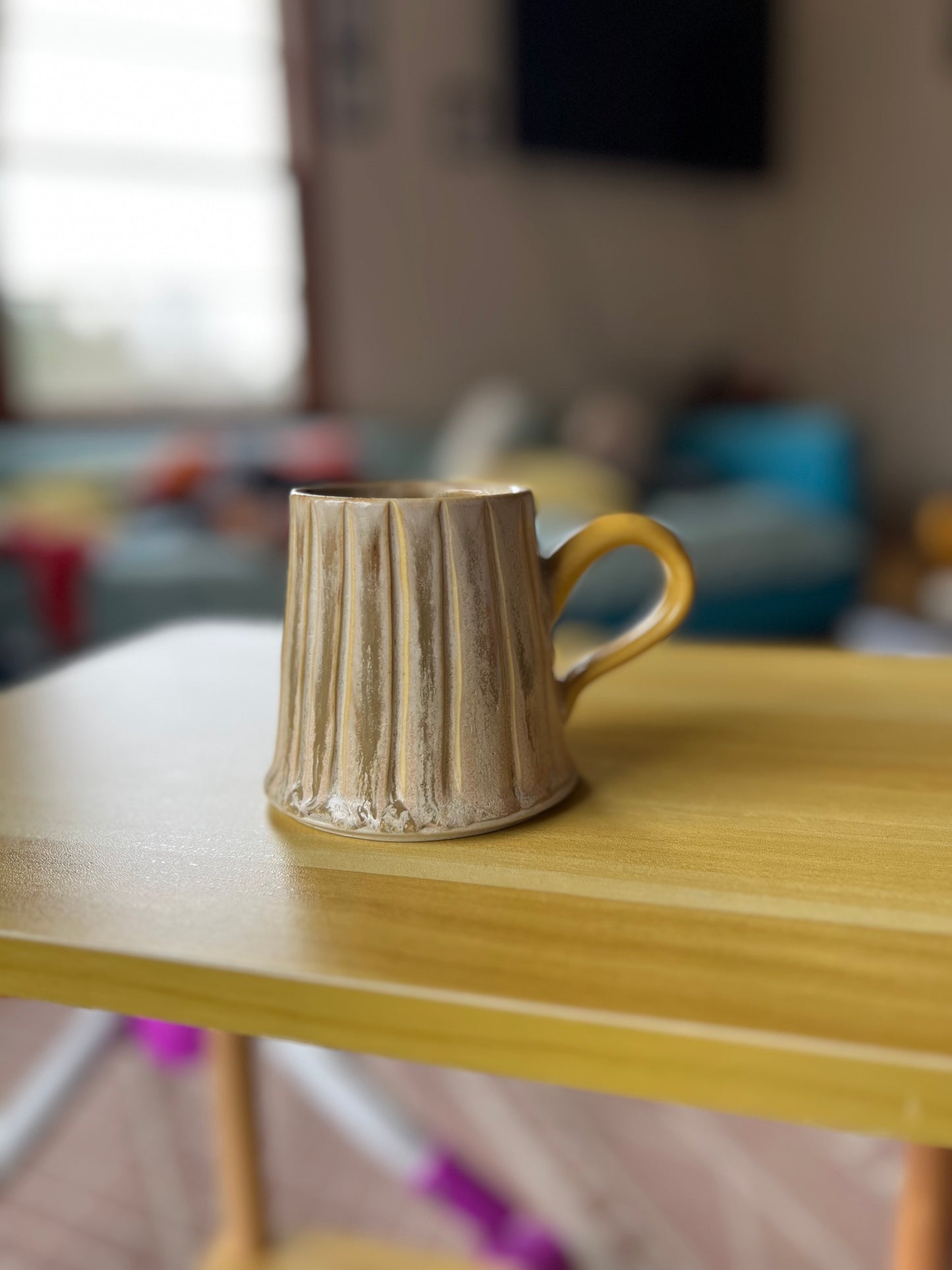 Small yellow handle mug